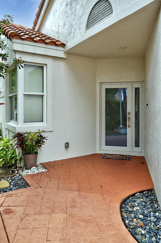 17744 Candlewood Ter, Boca Raton, FL 33487 - doorway to property with stucco siding