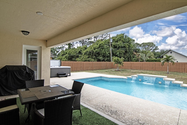 view of pool featuring a patio, a fenced in pool, a fenced backyard, and a hot tub