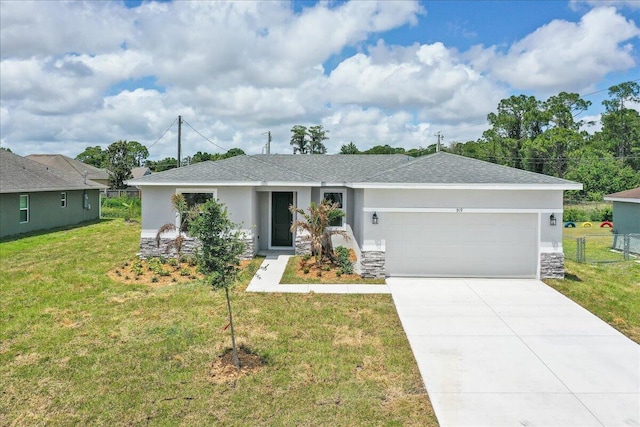 ranch-style home with a front lawn, stucco siding, an attached garage, driveway, and stone siding