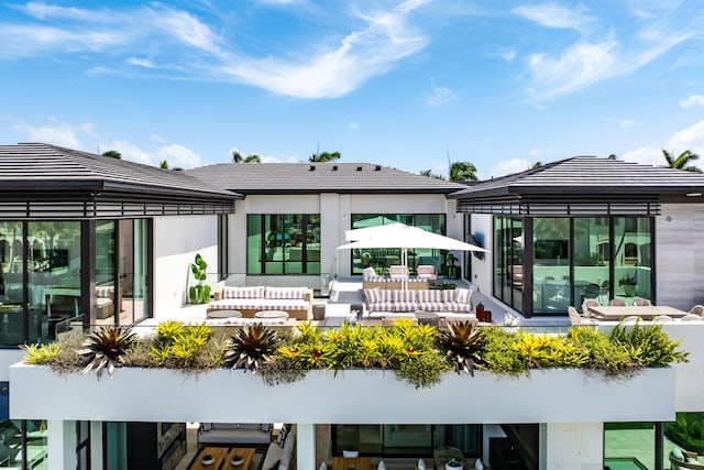 207 W Coconut Palm Rd, Boca Raton, FL 33432 - rear view of property with outdoor lounge area