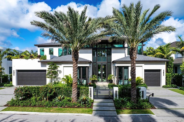 207 W Coconut Palm Rd, Boca Raton, FL 33432 - view of front facade with driveway and stucco siding