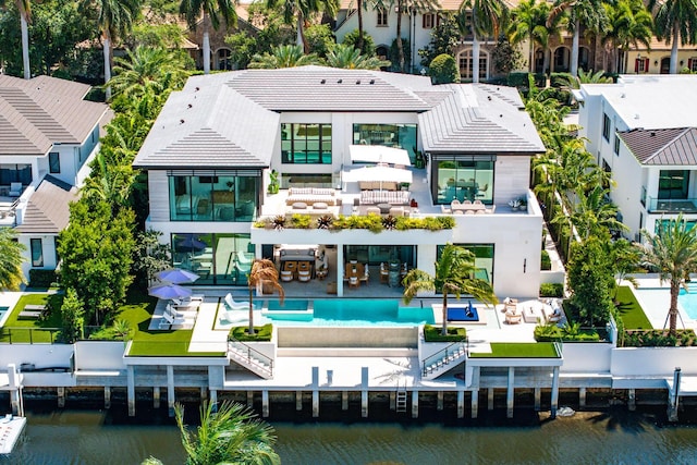 207 W Coconut Palm Rd, Boca Raton, FL 33432 - rear view of property featuring a balcony, a residential view, and a water view