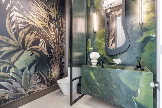207 W Coconut Palm Rd, Boca Raton, FL 33432 - bathroom with toilet, tile patterned flooring, wallpapered walls, and a sink