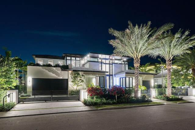 207 W Coconut Palm Rd, Boca Raton, FL 33432 - view of front of house featuring stucco siding, a gate, and fence private yard