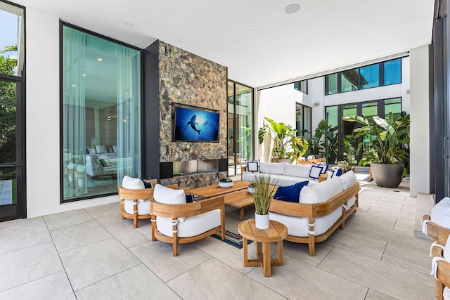 207 W Coconut Palm Rd, Boca Raton, FL 33432 - living room with floor to ceiling windows and tile patterned floors