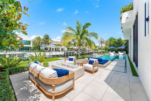 207 W Coconut Palm Rd, Boca Raton, FL 33432 - view of patio with an outdoor living space with a fire pit and an outdoor pool