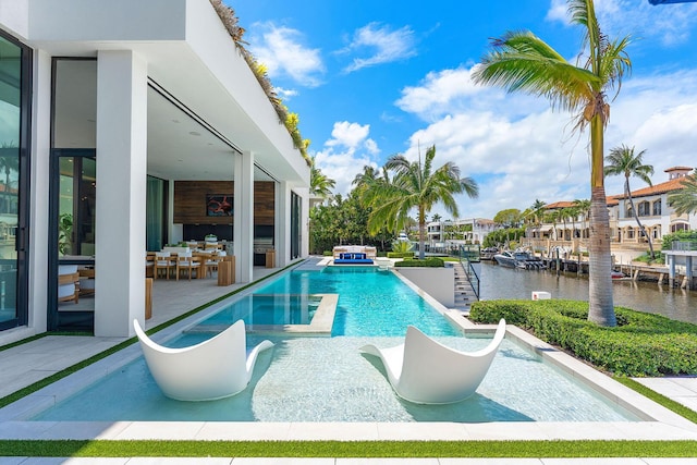 207 W Coconut Palm Rd, Boca Raton, FL 33432 - view of swimming pool with a patio, a water view, and a pool with connected hot tub