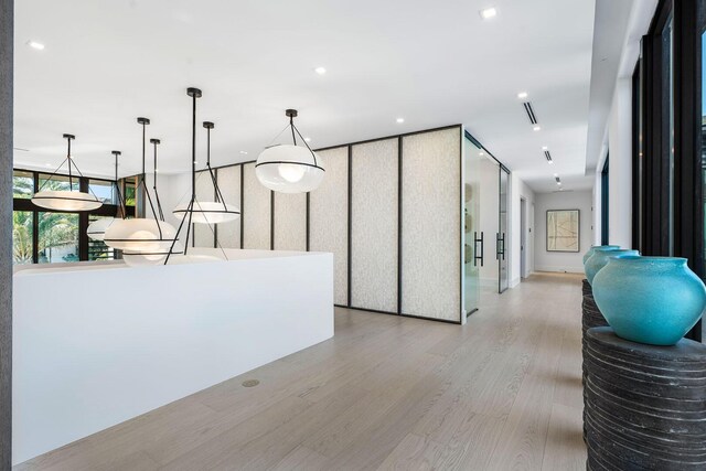 207 W Coconut Palm Rd, Boca Raton, FL 33432 - interior space featuring light wood finished floors, hanging light fixtures, and recessed lighting