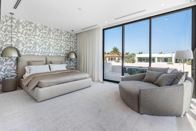 207 W Coconut Palm Rd, Boca Raton, FL 33432 - bedroom featuring visible vents, wallpapered walls, access to exterior, and a wall of windows