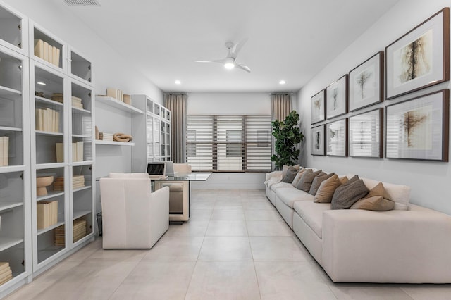 living room with ceiling fan, light tile patterned floors, recessed lighting, and baseboards