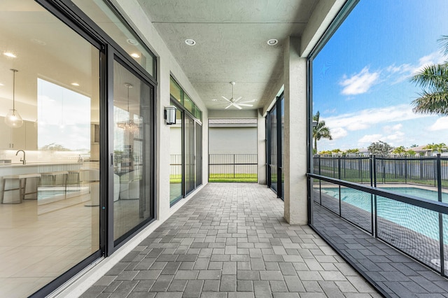 unfurnished sunroom with a sink
