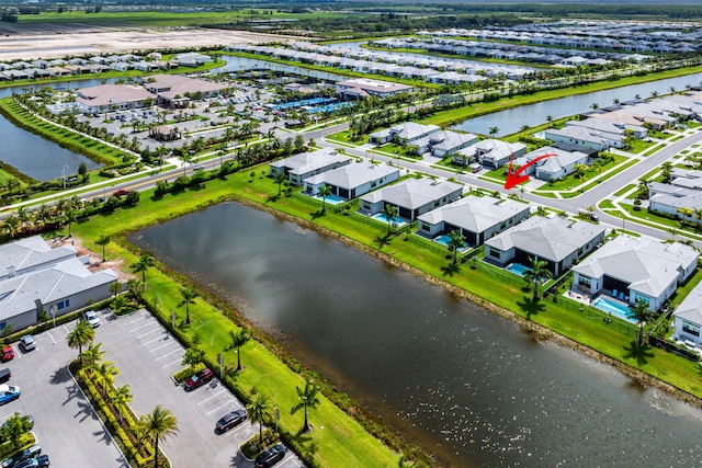 aerial view of residential area with a large body of water