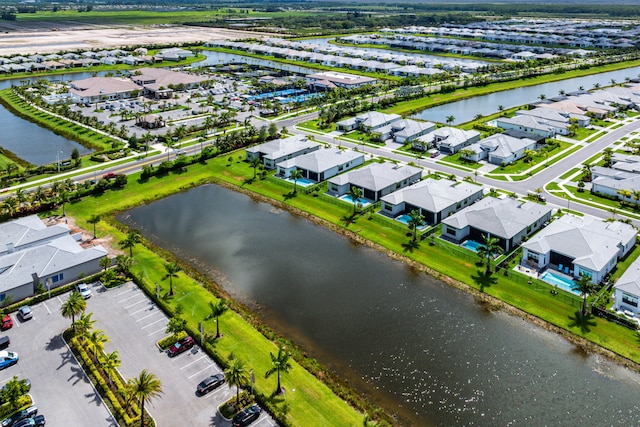 aerial perspective of suburban area featuring a nearby body of water