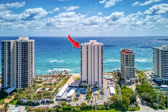 birds eye view of property with a water view