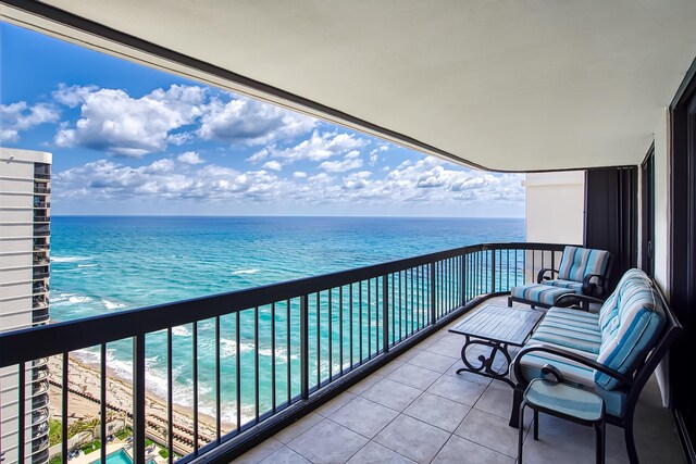 balcony featuring a water view