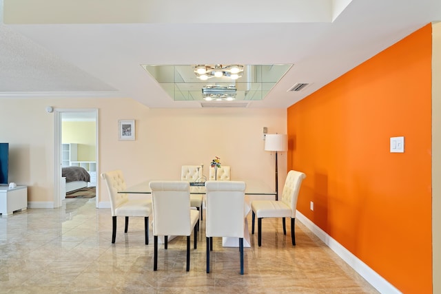 dining space featuring a chandelier, visible vents, marble finish floor, and baseboards