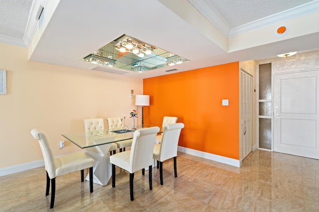 dining area featuring baseboards, crown molding, a textured ceiling, and visible vents