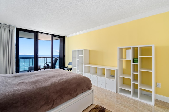 bedroom with a textured ceiling, a water view, access to outside, expansive windows, and ornamental molding