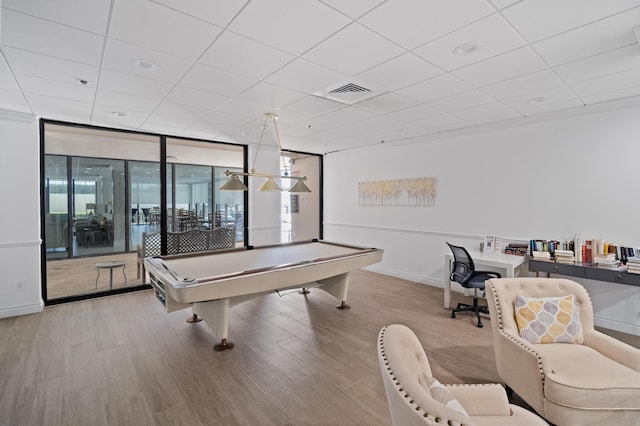 game room featuring wood finished floors, expansive windows, billiards, baseboards, and visible vents