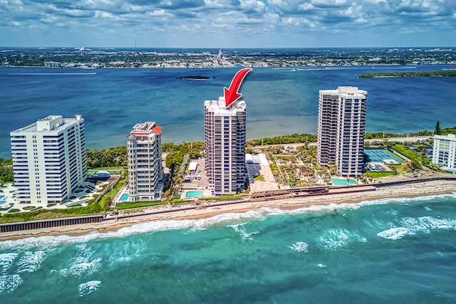 aerial view with a city view, a beach view, and a water view