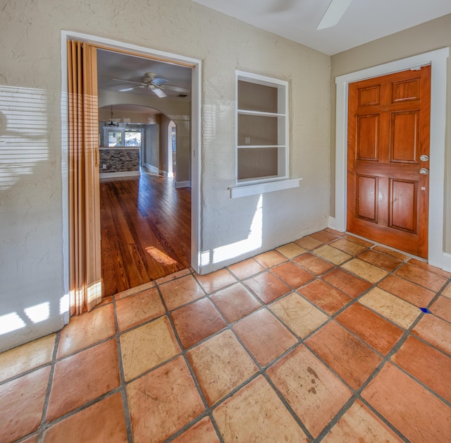 524 S K St, Lake Worth Beach, FL 33460 - entryway featuring a ceiling fan, arched walkways, and baseboards