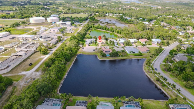 541 NW Pine Sap Pl, Jensen Beach, FL 34957 - aerial view of property and surrounding area with a large body of water and nearby suburban area