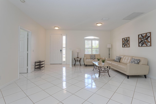 541 NW Pine Sap Pl, Jensen Beach, FL 34957 - living area featuring baseboards and light tile patterned floors