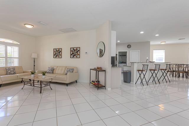 541 NW Pine Sap Pl, Jensen Beach, FL 34957 - living room featuring recessed lighting and light tile patterned flooring