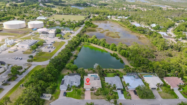 541 NW Pine Sap Pl, Jensen Beach, FL 34957 - aerial view of property and surrounding area featuring a large body of water and nearby suburban area