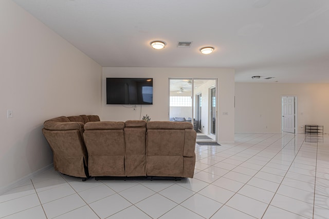541 NW Pine Sap Pl, Jensen Beach, FL 34957 - living room with a ceiling fan, light tile patterned flooring, and baseboards