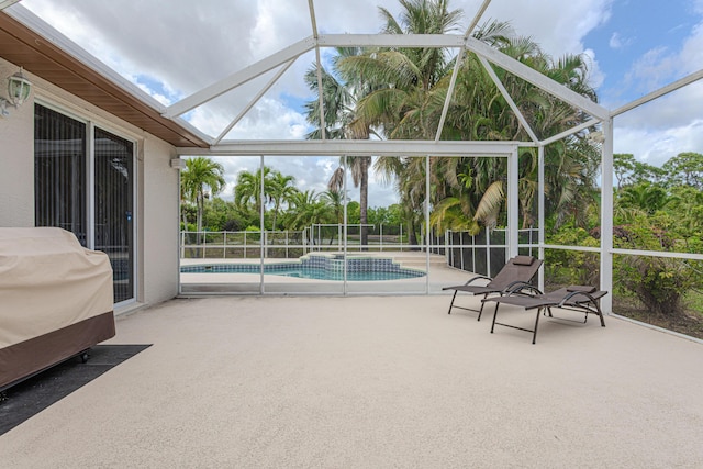 541 NW Pine Sap Pl, Jensen Beach, FL 34957 - view of swimming pool featuring a patio area, glass enclosure, and a pool with connected hot tub