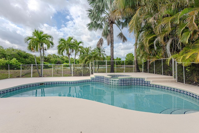 541 NW Pine Sap Pl, Jensen Beach, FL 34957 - view of swimming pool with a pool with connected hot tub