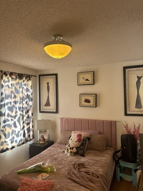 6207 Adriatic Way, West Palm Beach, FL 33413 - bedroom featuring a textured ceiling