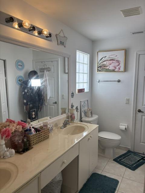 6207 Adriatic Way, West Palm Beach, FL 33413 - full bathroom with tile patterned floors, visible vents, a sink, and double vanity