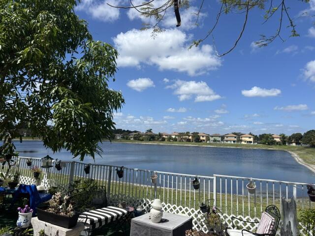 6207 Adriatic Way, West Palm Beach, FL 33413 - view of water feature with fence