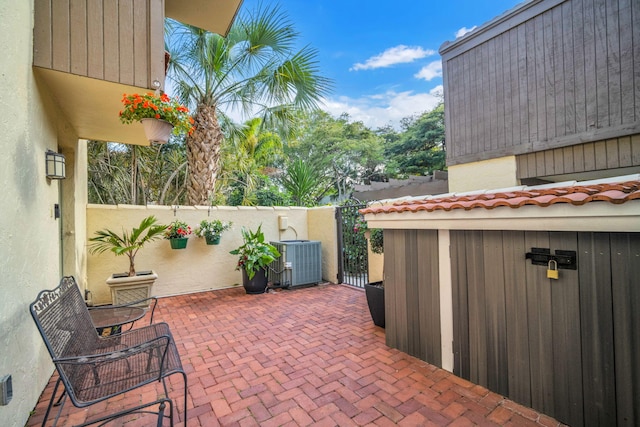 1330 NW 13th St Unit 6, Boca Raton, FL 33486 - view of patio with central air condition unit, fence, and a gate