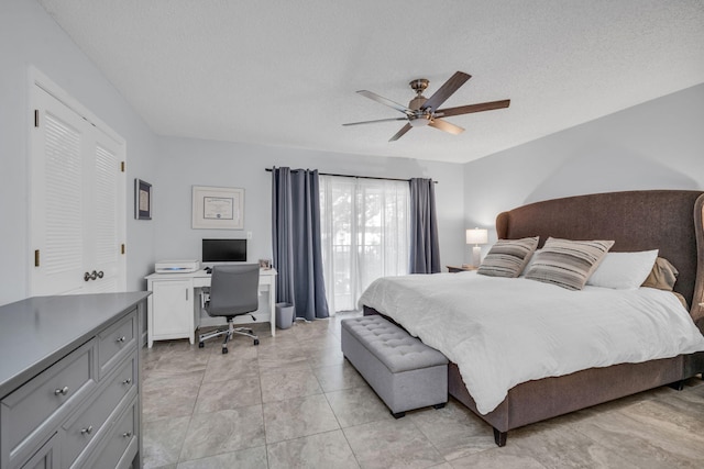 1330 NW 13th St Unit 6, Boca Raton, FL 33486 - bedroom featuring an office area, a textured ceiling, and a ceiling fan
