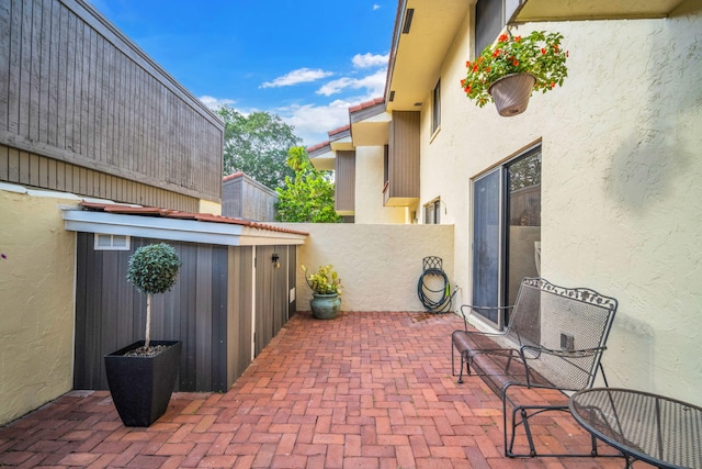 1330 NW 13th St Unit 6, Boca Raton, FL 33486 - view of patio featuring fence