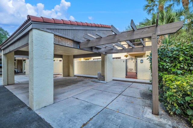 view of patio with a gate, a pergola, and fence private yard