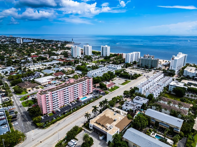 birds eye view of property featuring a city view and a water view