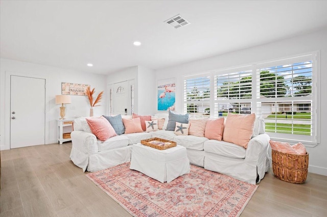 509 Oak Ter, Jupiter, FL 33458 - living room with recessed lighting, wood finished floors, and visible vents