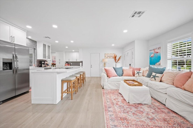 509 Oak Ter, Jupiter, FL 33458 - living room with light wood-type flooring, visible vents, and recessed lighting