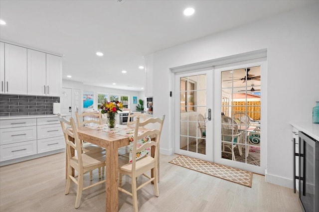 509 Oak Ter, Jupiter, FL 33458 - dining space with recessed lighting, french doors, wine cooler, and light wood-style flooring