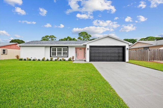 509 Oak Ter, Jupiter, FL 33458 - ranch-style home with fence, stucco siding, an attached garage, driveway, and a front yard