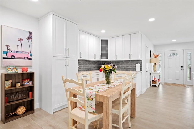 509 Oak Ter, Jupiter, FL 33458 - dining space with recessed lighting and light wood-type flooring