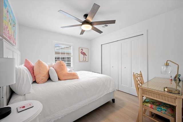 509 Oak Ter, Jupiter, FL 33458 - bedroom with visible vents, wood finished floors, a closet, and ceiling fan