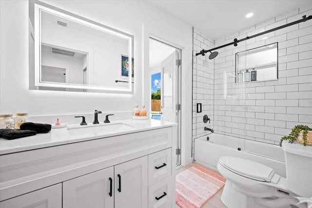 509 Oak Ter, Jupiter, FL 33458 - bathroom featuring toilet, visible vents, recessed lighting, combined bath / shower with glass door, and vanity
