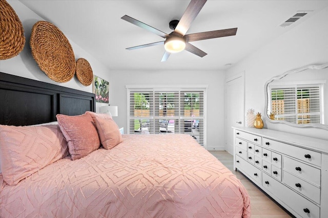 509 Oak Ter, Jupiter, FL 33458 - bedroom with a ceiling fan, light wood finished floors, multiple windows, and visible vents