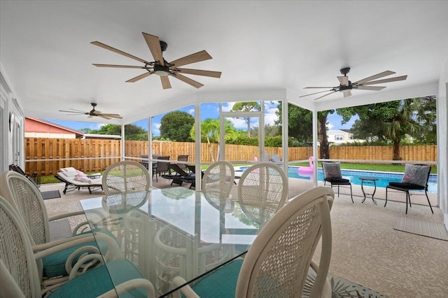 509 Oak Ter, Jupiter, FL 33458 - view of patio / terrace featuring a fenced backyard, outdoor dining space, a fenced in pool, and ceiling fan