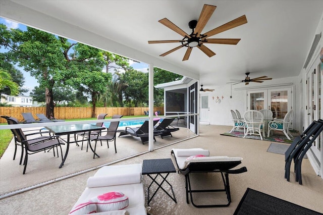 509 Oak Ter, Jupiter, FL 33458 - view of patio with outdoor dining space, french doors, a fenced backyard, a fenced in pool, and ceiling fan